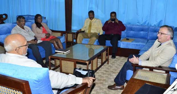 President Donald Ramotar (backing camera) during the meeting with, from left,  Minister of Labour, Dr. Nanda K. Gopaul; Minister of Human Services and Social Security, Ms. Jennifer Webster;  Chief Labour Officer, Mr. Charles Ogle; Senior Labour Officer, Mr. Prandatt Basdeo; and ILO’s Dr. Giovanni di Cola