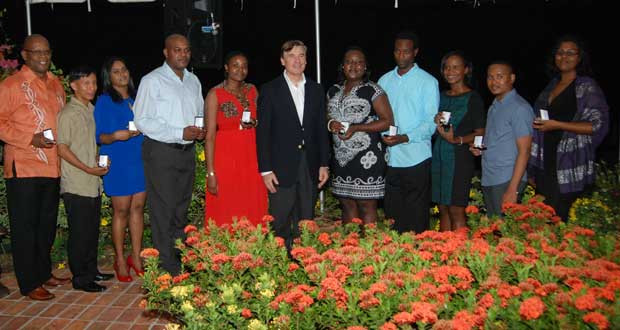 The 10 practicing journalists who were honoured at the Press Freedom reception Friday night, hosted by US Ambassador to Guyana, Brent Hardt, at centre (Photo by Cullen Bess Nelson)