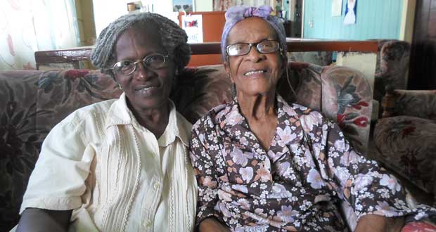 All smiles. Our winsome centenarian, Mrs. Helena Maud Mc Allistair, and her daughter, Mrs. Ruth Cumberbatch, share a moment together.