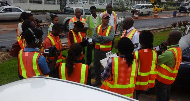 Engineer Julian Archer is flanked by members of the media as he briefs them on the situation at the worksite