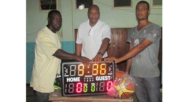 Photo shows from left, former national player Mark Agard, GABF president Nigel Hinds and BABA vice-president Robert Esseboom after the handing-over of the game clock and other equipment.