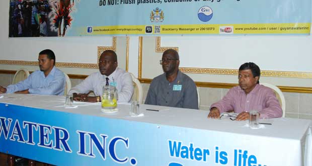 Members of the head table: Executive Director, Infrastructure Planning and Implementation, Ramchand Jailal; GSIP Programme Manager, Orin Browne; Manager, Sanitation GWI, Rensforde Joseph; and Chief Executive Officer, GWI, Shaik Baksh.