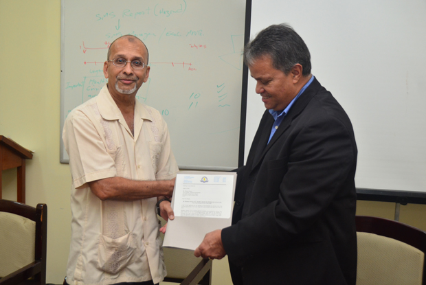 Handing over of the official operations document by Director General of GCAA, Zulficar Mohamed, to Chief Executive Officer of Roraima Airways, Captain Gerald Gouveia