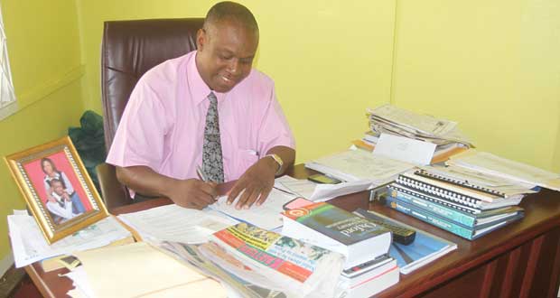 Thou shall not be moved! Chronicle photographer Sonell Nelson caught GFF president Christopher Matthias handling business as usual at his office yesterday.