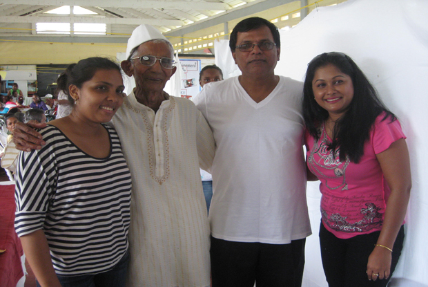 93 year old geriatric patient, Seepersaud Mangru flanked by Ms. Melissa Ramdeen, Dr. Vishwa Mahadeo and Dr. Vanita Ali