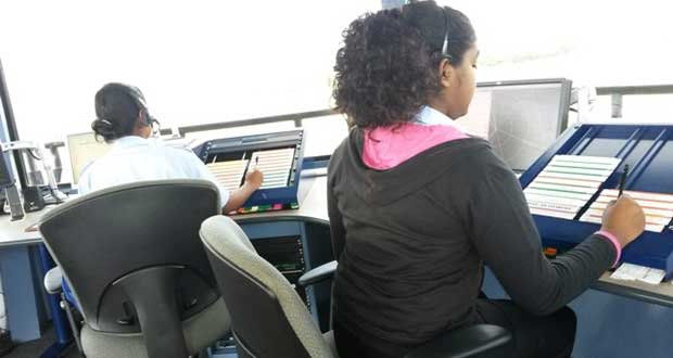 From left:  Mrs. Francesca Wilson and Ms. Jennita Bhagwandin at the control position in the Timehri Control Tower.