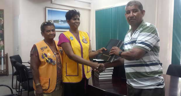 Toshao Aubrey Samuels receiving the donation from the President of the Lions Club of Demerara Lioness, Lioness Gillian Orderson, alongside Carole Persaud, long-standing member of the club