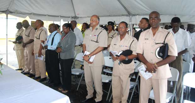 From right are Traffic Chief Denhert, Commander Hicken, Commissioner Seelall Persaud, PS Johnson, a religious member, Traffic Officer Brutus, Deputy Commander Moore, and
Force Training Officer Williams
