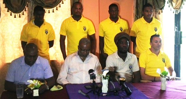 Alpha United players (Standing) along with  Steve Ninvalle, President Odinga Lumumba and Coach Wayne Dover while addressing the Media yesterday