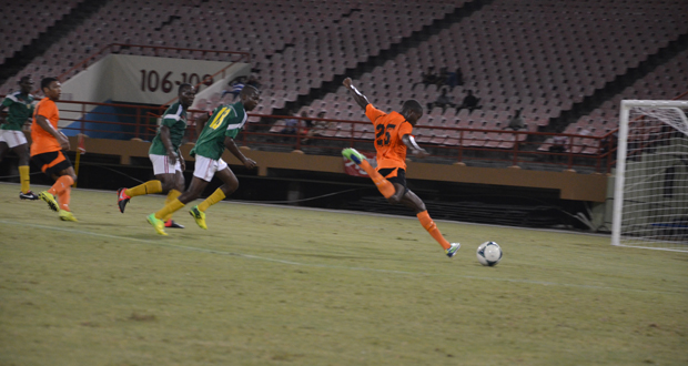 Slingerz FC’s Dominic Garnett about to blast home his second goal against GDF at the Guyana National Stadium.