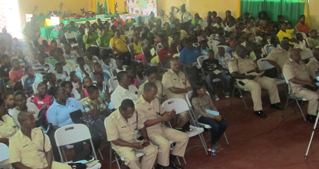 The gathered police personnel, campers and their supervisors at the closing ceremony of the camp