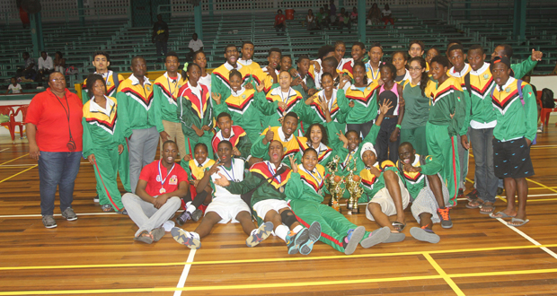 Winners! Athletes and officials from the Guyana team celebrate at the IGG closing ceremony last evening at the Cliff Anderson Sports Hall. (Sonell Nelson photo)