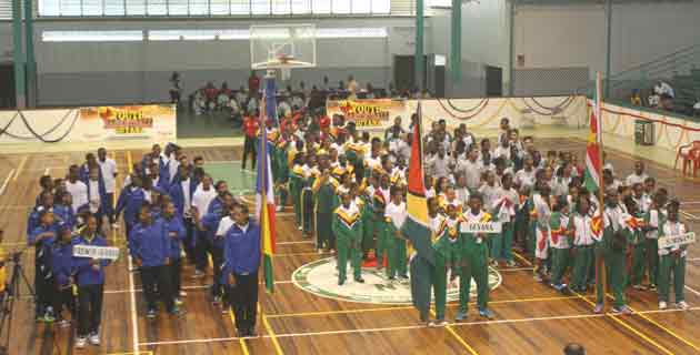 Let the Games Begin! Teams from French Guiana (left), Guyana (centre) and Suriname at the Cliff Anderson Sports Hall during the opening of the Inter-Guiana Games yesterday.(Sonell Nelson photo)