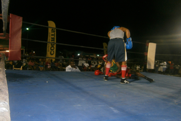 That is it for you tonight. A seasoned Kevin Allicock of Republican Gym stands over a fallen Arthur Scipio of the Guyana Defence Force Gym, during their 52 kg contest which Allicock won by TKO in the second round