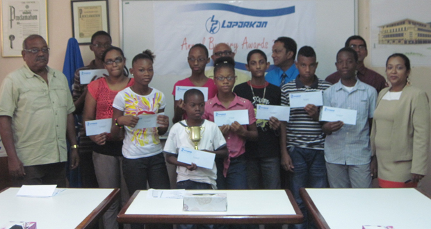 In picture, new and previous awardees pose with the Consultant of Wm. Fogarty Ltd. Mr. Oscar Phillips and CFO/Corporate Secretary, Mr. Sahadeo Ramkirath (back row with blue shirt) and other Executives of the Laparkan Group