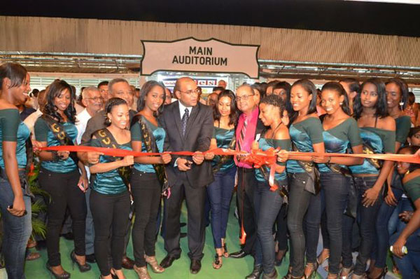 Former President, Dr Bharrat Jagdeo cutting the ribbon at the opening of GuyExpo 2011