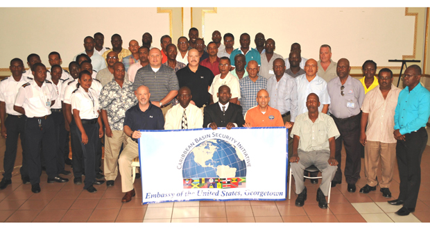 US Embassy officials and US Coast Guard personnel pose alongside participants of the just-concluded training programme for Guyanese port security workers and sea cadets, designed to enhance port security