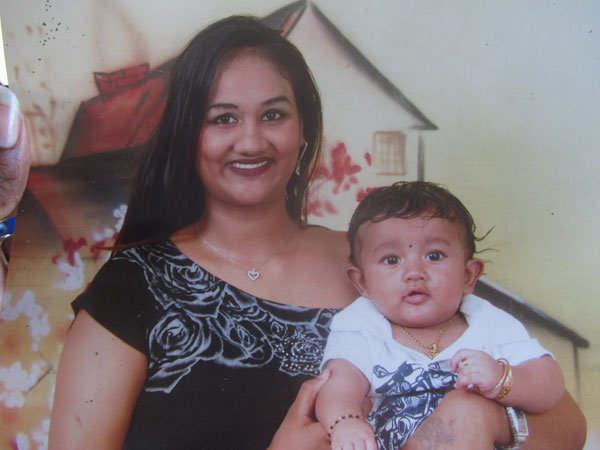The murdered Rajkumarie Persaud with her infant son in happier times