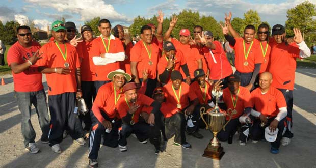 The victorious Our Own Sports Club players pose after their third consecutive championship win.