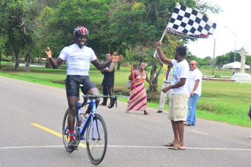 Yes I did it! The smile on the face of Orville Hinds says it all, as he crosses the finish line alone to take the top prize in this year’s Digicel ‘Cancer Awareness Ride’. (Photos by Adrian Narine)