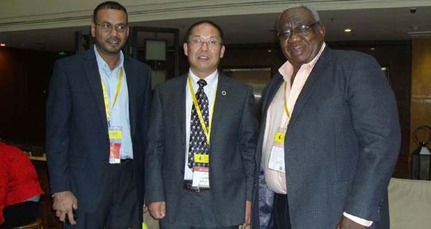 Minister Robert Persaud and GGMC Chairman, Mr. Clinton Williams, along with another participant at the mining conference