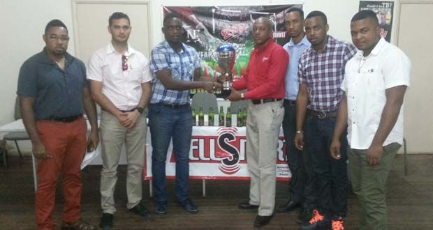 (L-R) Kenrick Noel, Stag Beer Brand Manager John Maikoo, Aubrey Major Jr, Sales and Operations Manager at Cell Smart Lenford Malcolm, Sean Abel, Stag Beer Representative, Shareef Major and Winston Fraser.