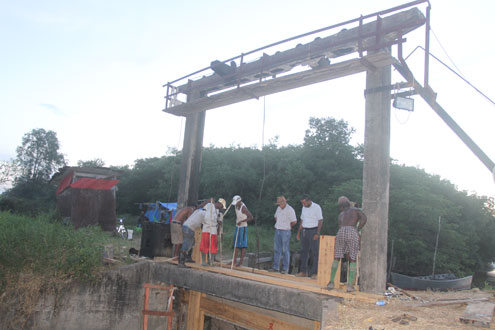 Head of the NDIA, Mr. Lionel Wordsworth inspecting the ongoing works on the koker