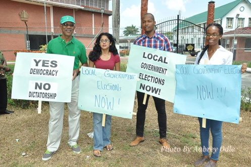 From left, APNU Leader, Brigadier (Rtd) David Granger, with Mr. Clinton Urling, third left, with others during a protest last Tuesday outside of the Office of the President (Photo courtesy of Aubrey Odle)