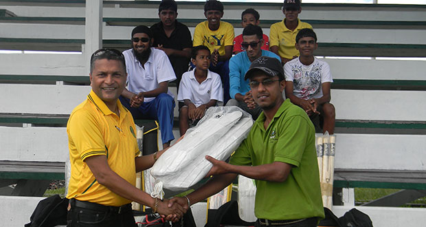 Safraz Ali, Industrial Welfare Officer and Committee Development Officer of Rose Hall Estate (right), receiving the kit from GCB Secretary, Anand Sanasie.