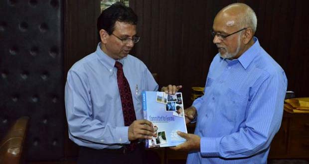 GT&T Chief Executive Officer, Mr R.K. Sharma presenting President Donald Ramotar with a copy of the 2014 telephone directory