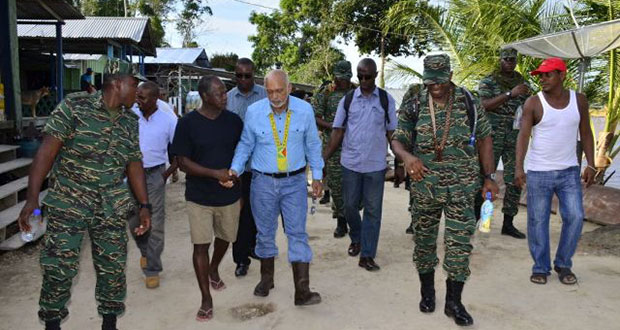Commander of the Armed Forces, President Donald Ramotar at Eteringbang, where he made a brief stop-over
