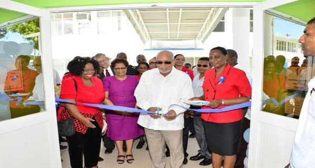 President Donald Ramotar cuts the traditional ribbon to formally open the Davis Memorial Dental Clinic