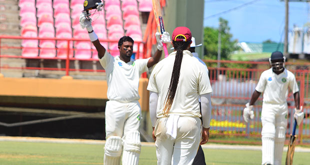 Congratulations Jhonny Ringo! Guyana Jaguars’’ Narsingh Deonarine salutes his teammates after chalking up his 10th first class ton yesterday at the Guyana National Stadium against the Leeward Islands. (Photo by Adrian Narine)