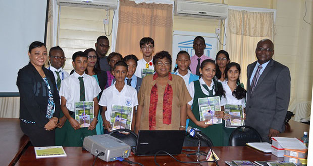 Science Coordinator at the Ministry of Education, Ms Petal Jettoo (left); Chief Education Officer, Mr Olato Sam (right); and UNESCO’s Ms Inge Nathoo (centre) with students representing the science clubs of various schools
