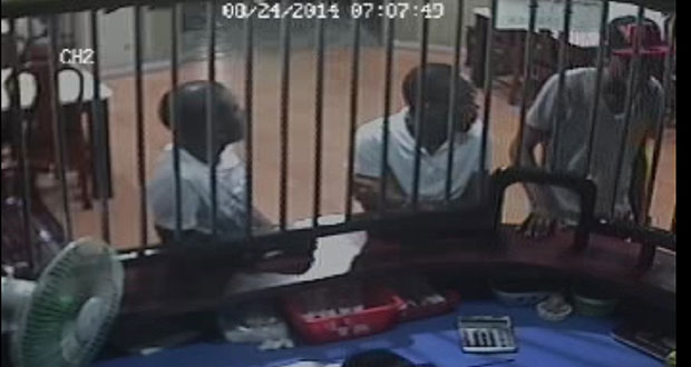 The image of the suspect issued by the police (wearing the red and black cap)