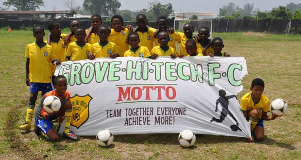 Champions  Grove Hi Tech Football club display their motto