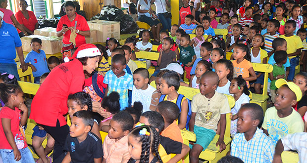 First Lady, Madame Deolatchmee Ramotar greets the children of Bartica
