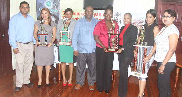 Best Booth winners displaying their awards in company of GTA officials (Photo by Sonell Nelson)