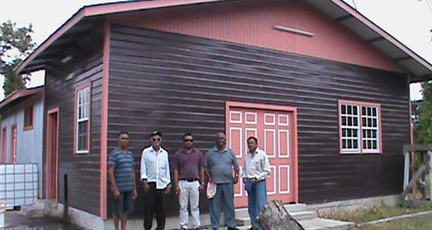 Minister Alli Baksh with Region Two Vice Chairman Mr Vishnu Samaroo, farmer Persaud and other Government officers infront the Multi million dollar coffee,citrus and cocoa factory at Jacklow, Pomeroon River
