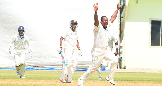 Yes we did it! An ecstatic Dwayne Smith (hands in air) bellows for a successful appeal against a bewildered looking Devendra Bishoo yesterday to seal the come from behind win for Barbados Pride, as wicketkeeper Shane Dowrich (left) and Ashley Nurse (partly hidden rushes in to start the celebrations). Photo by Adrian Narine)