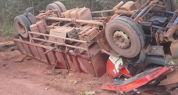 The toppled truck. One of the dead men is to the extreme left at the back of the truck