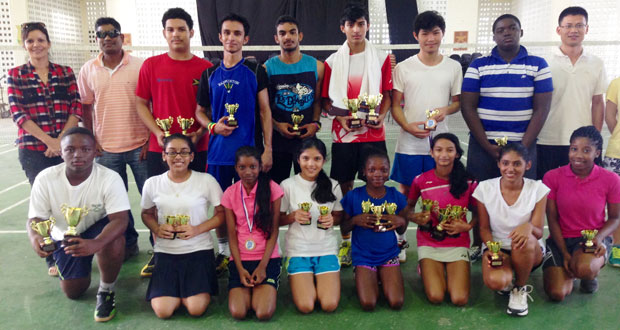 Winners of the Woodpecker Badminton Tournament pose with their prize, third from right in th front row is Priyanna Ramdhani