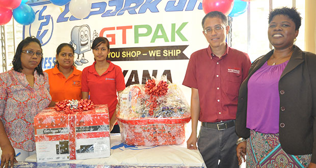 First-prize winner, Justin Singh (second right), with (from left)  Laparkan members of staff, Sherry Singh, Parbattie Singh, Nirmala Singh and Sales Manager, Yonette Jeffers