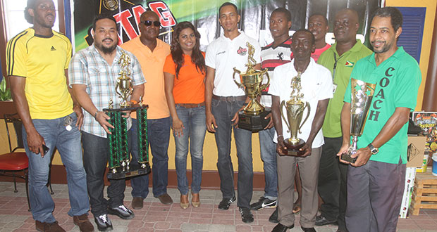 The top four EBFA clubs show off their trophies after receiving cash awards from Ansa McAl’s PRO Darshanie Yusuf (4th left) and Assistant Stag Beer Brand Manager Sean Abel (5th left). Also in photo are EBFA Secretary Franklin Wilson (3rd left) and President Wayne Francois (3rd right)
