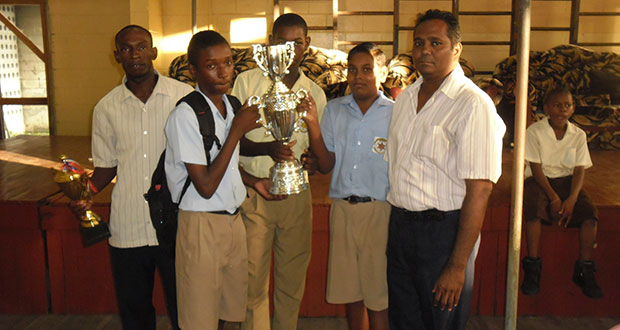 Members of the victorious NAMS team pose with their championship trophy