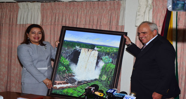Foreign Affairs Minister, Carolyn Rodrigues-Birkett, presents the UNASUR Secretary General, Dr. Ernesto Samper Pizano, with a token from his visit to Guyana