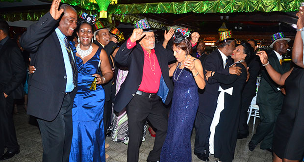President Donald Ramotar, First lady Deolatchmee Ramotar, Prime Minister Samuel Hinds, Mrs. Yvonne Hinds, Guyana Defence Force Chief of Staff Brigadier Mark Phillips,  Mrs Phillips and Senior Guyana Defence Force Officers dancing on Old Year’s night at Base Camp Ayanganna, Georgetown