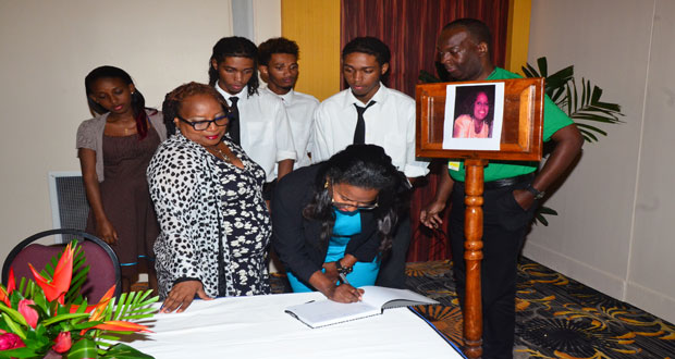 The Y3K siblings pose with Fly Jamaica Marketing Representative Wesley Tucker and Dr. Dawn Stuart-Lyken as Tiffany Johnson signs the Book of Condolences for the late Dr. Faith Harding (Photo by Adrian Narine)
