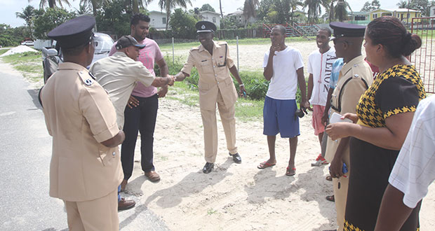 Police, community members, footballers and a business partner meet with a contractor in Agricola on Wednesday to discuss  development of the community ground