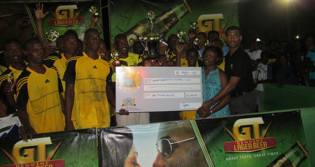 Champions Winners Connection receive their $1M cheque from Ms Shondel Easton. Banks DIH Linden Branch Manager, and Errol Nelson, Banks DIH Aqua Mist Manager, after copping the championships for the second straight year.